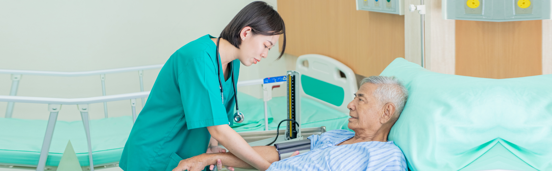 Asian nurse blood pressure monitor senior man in hospital